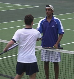Manu Nathan '00 shakes hands with an Andover opponent after a three-set victory.