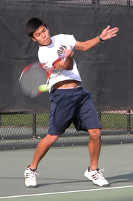 Ming Ong '05 drives a forehand.